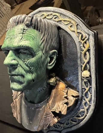 Opposite side view of Frank bust and gold-toned neck bolt
