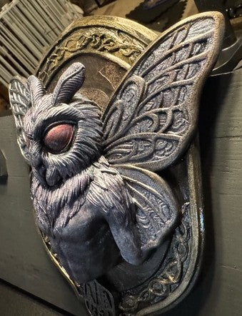 Angled view of Mothman plaque and raised wing details