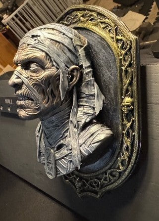 Opposite side view of Mummy bust and ornate frame
