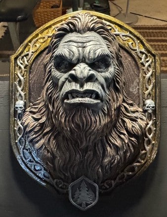 Front view of Sasquatch bust wall plaque with sculpted fur and ornate frame