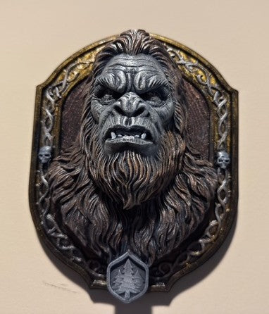 Angled view of Sasquatch bust and skull-accented border