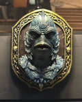 Front view of ornate lagoon-creature plaque