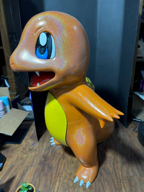Life-size hand painted Charmander 3D printed statue in amber and gold tones