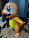 Life-size hand painted Charmander 3D printed statue in amber and gold tones