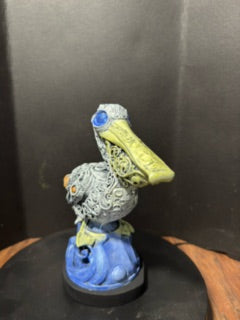 Ornate pelican statue back view