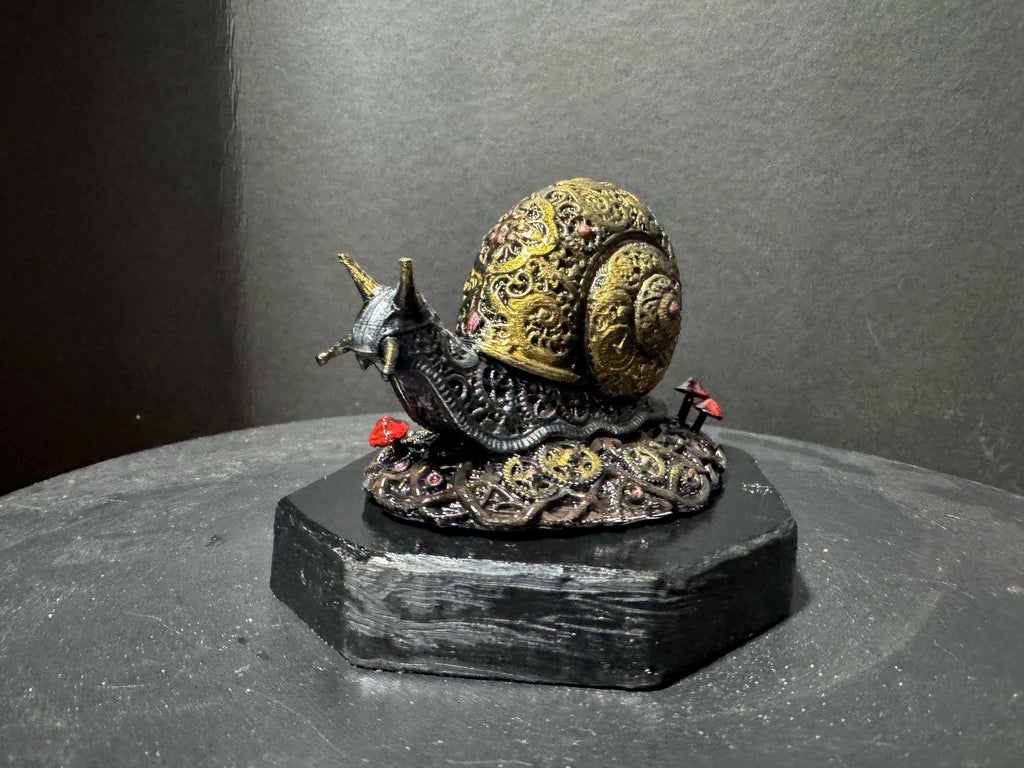 Forest Guardian Snail - rear view showing full golden shell detail