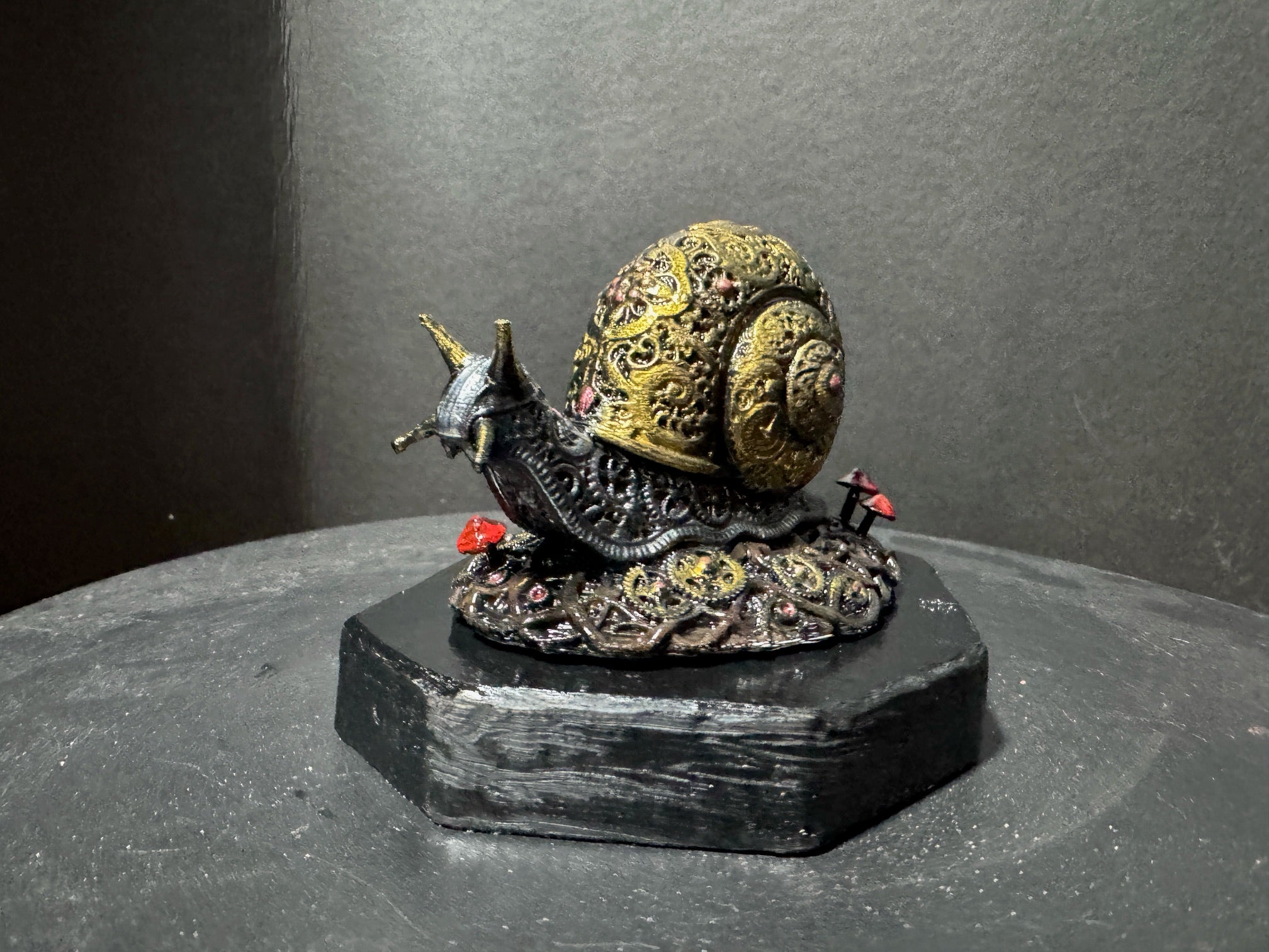 Forest Guardian Snail - rear view showing full golden shell detail