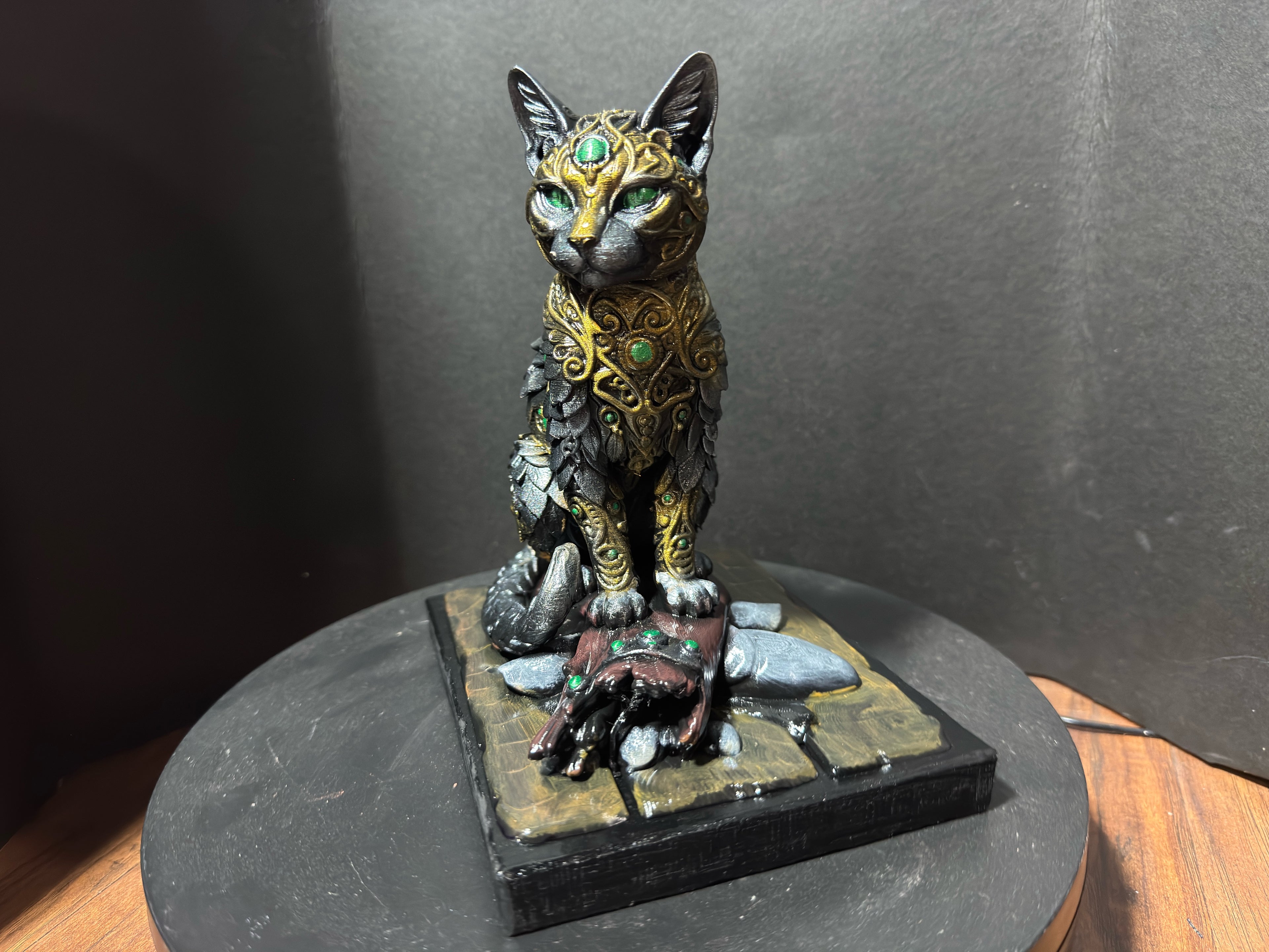 Forest Guardian Cat - front view showing emerald green eyes and gold crown forehead filigree