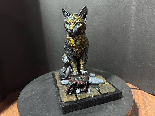 Forest Guardian Cat - front view showing emerald green eyes and gold crown forehead filigree