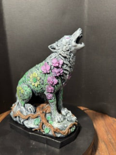 Ornate howling wolf statue back view