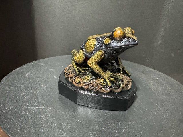 Forest Guardian Frog - front-facing view showing wide gold forehead and amber eyes