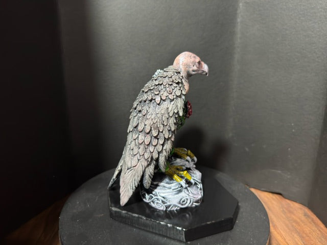 Side view of The Ossuary Rose vulture statue showing layered feather detail