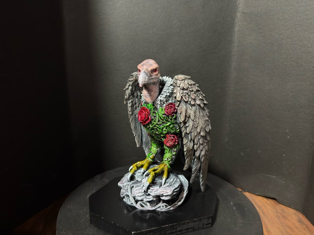 Front view showing crimson roses and ivy detail on vulture chest