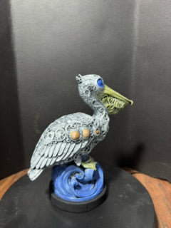 Ornate pelican statue side view