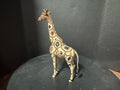 Front view of Savanna Gold beaded giraffe statue showing floral bead motifs