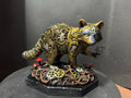 Forest Guardian Raccoon - front view showing gold filigree body and green eyes