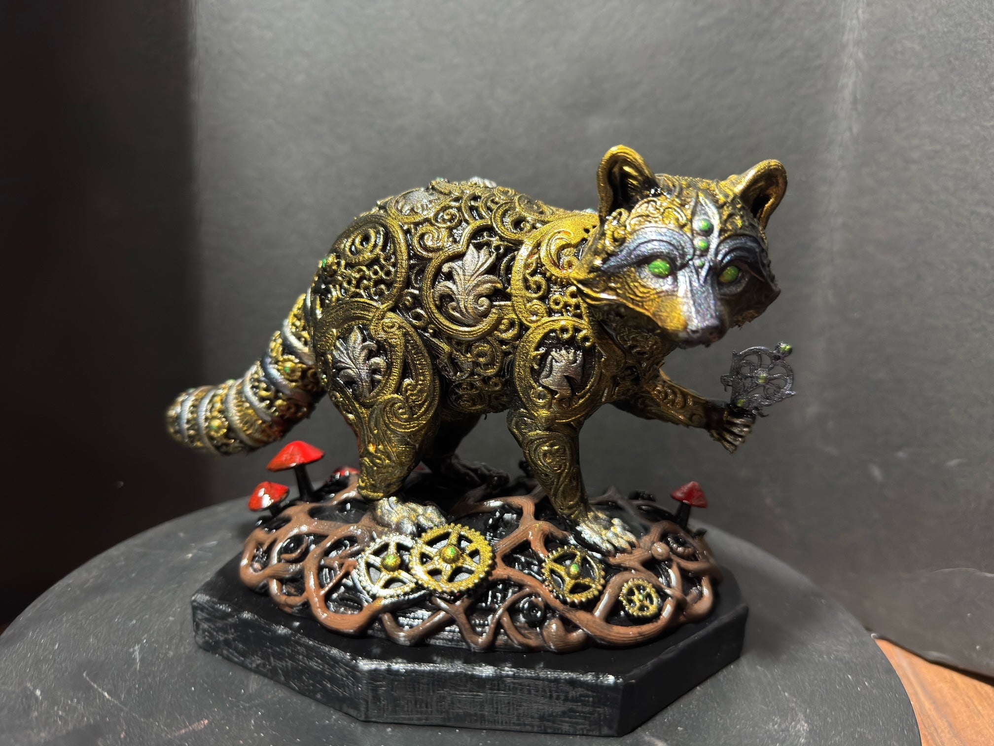 Forest Guardian Raccoon - front view showing gold filigree body and green eyes