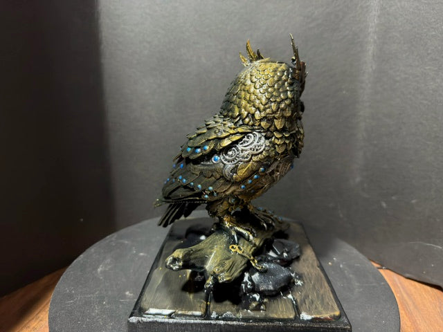 Forest Guardian Owl - three-quarter view showing silver filigree chest and gnarled branch base