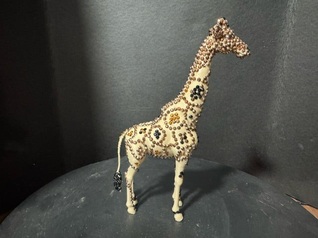 Three-quarter rear view of Savanna Gold beaded giraffe statue