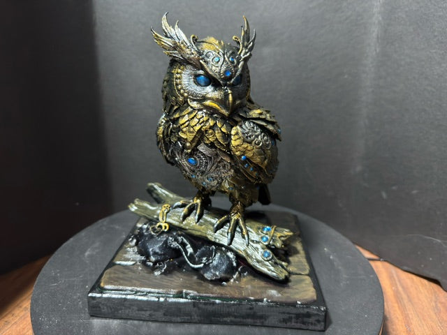 Forest Guardian Owl - front view showing blue gem eyes and spiked silver-gold crest
