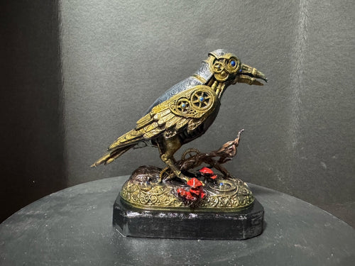 Forest Guardian Crow - side view showing gold filigree wings and blue sapphire eye