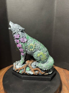 Ornate howling wolf statue side view